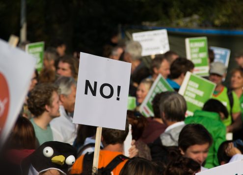 Protest with a sign that says No!