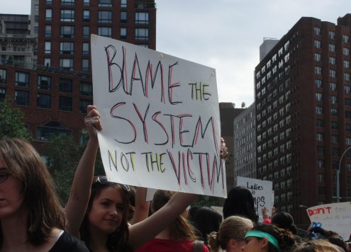 victim blaming protest sign