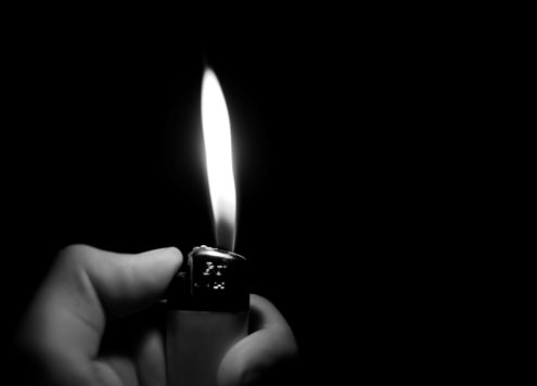 Black and white photo of a lighter flame