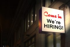 Back-lit sign reading 'Come in, We're HIRING!'