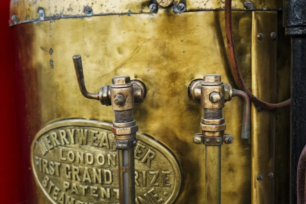 how to find a reliable plumber london - Detailed view of vintage brass valves from an old fire engine in London showcasing historic craftsmanship - Brass valves are prominently displayed on a vintage fire engine, highlighting intricate details and the craftsmanship of past engineering.